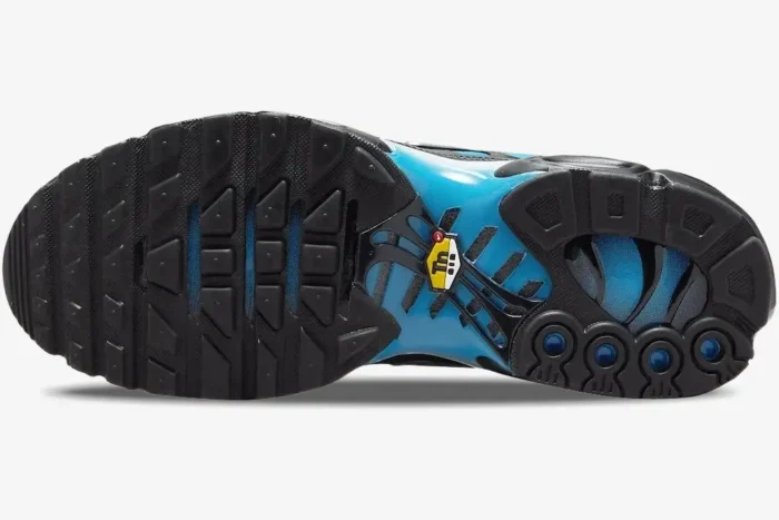 Bottom view of Nike Air Max Plus Gradient Blue White outsole with black tread and blue accents. - SKU FQ0204-010