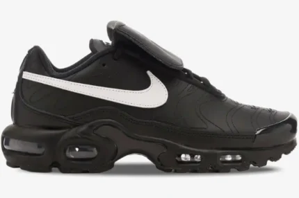 Side view of Nike Air Max Plus Tiempo hybrid sneakers in black leather with a white swoosh and visible air units. - SKU HF0074-001