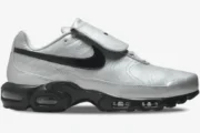 Nike Air Max Plus Tiempo in silver and black, side profile view showing the fold-over tongue and Air Max sole. - SKU HM6850-001