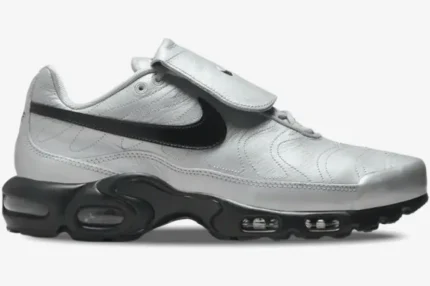 Nike Air Max Plus Tiempo in silver and black, side profile view showing the fold-over tongue and Air Max sole. - SKU HM6850-001