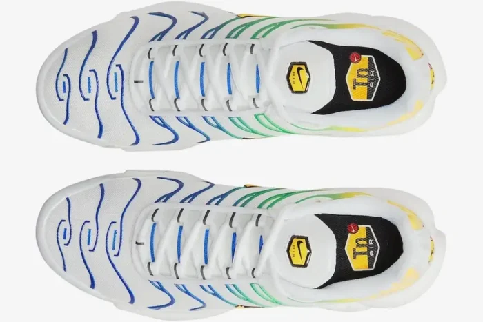 Top-down view of white Nike Air Max Plus TN Brazil Special Edition sneakers with blue, green, and yellow gradient cages. - SKU DZ3671-101
