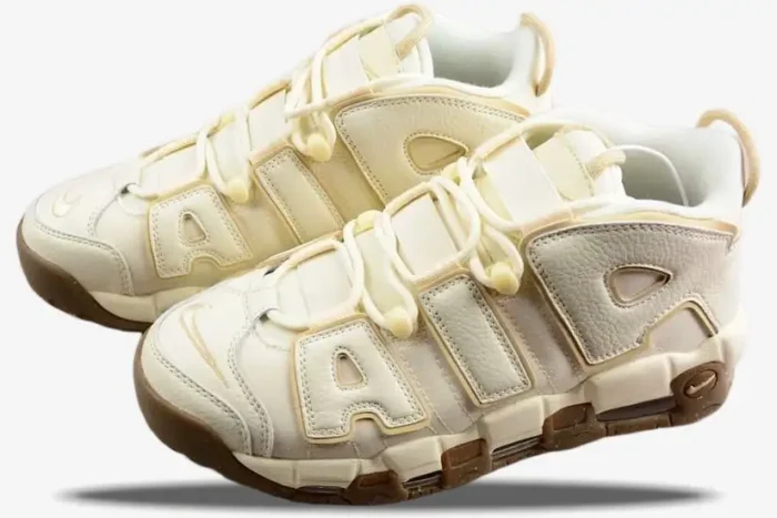 Nike Air More Uptempo '96 Coconut Milk sneakers in a three-quarter side view with gum brown soles. - SKU DV1137-100