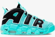 Nike Air More Uptempo sneakers in light aqua and black, shown from a side profile view. - SKU AA1554-403