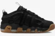 Nike Air More Uptempo Low in black with a gum sole, shown from a side profile view. - SKU FZ3055003
