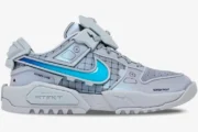 Side profile of the grey Nike Dunk Genesis x RTFKT Void sneaker with a bright blue swoosh and futuristic design. - SKU HF0438-001