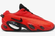 Nike Glide x NOCTA sneaker in red and black, side profile view showing chrome NOCTA branding. - SKU DM0879-600