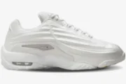 Side profile of the Nike Hot Step 2 x NOCTA sneaker in total white with molded ridges and visible Air unit. - SKU DZ7293-100