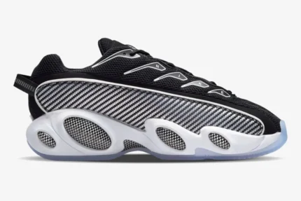 Side view of Nike NOCTA Glide sneakers in black and white with carbon fiber patterns and a thick white midsole. - SKU DM0879-001
