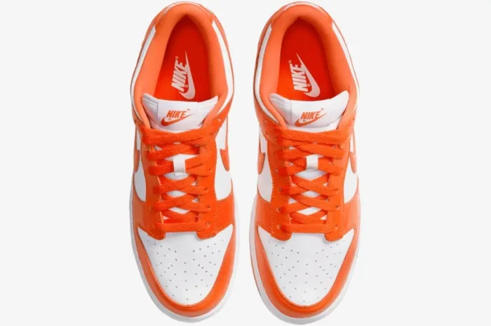 Top-down view of Nike SB Dunk Low Syracuse sneakers in vibrant orange and white leather. - SKU CU1726-101