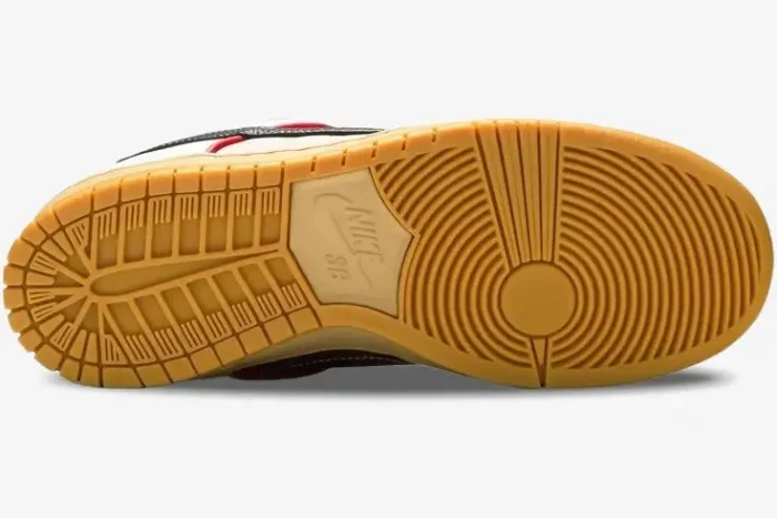 Bottom view of Nike SB Dunk Low x Paul Rodriguez What The Paul showing the textured gum rubber outsole. - SKU CZ2239-600
