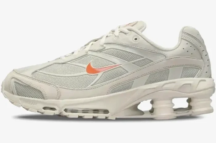 Nike Shox Ride 2 Cream Orange sneaker in a side profile view with visible Shox pillars and orange swoosh. - SKU DJ5415-100