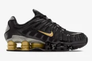 Side profile of Nike Shox TL x Neymar Jr. sneakers in black and gold with metallic accents. - SKU BV1388-001