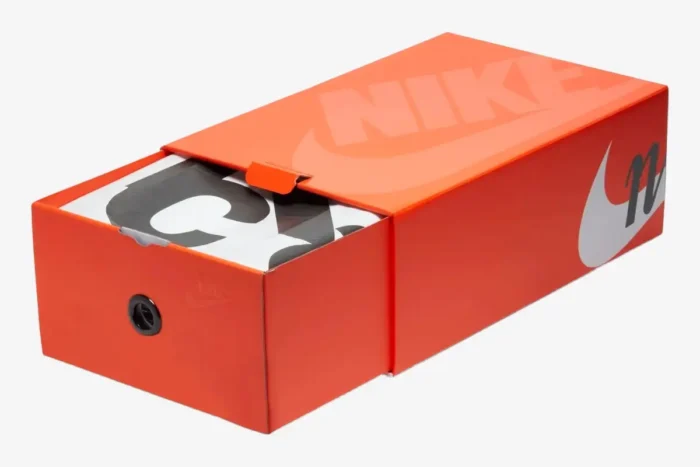 Orange Nike VaporWaffle x Sacai shoebox, drawer-style opening, angled perspective. - SKU DD1875-001