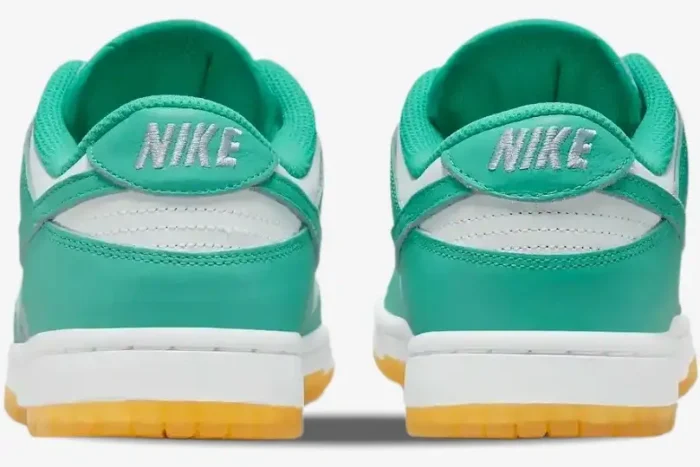 Rear view of Nike Wmns Dunk Low Teal Zeal sneakers featuring teal leather, white midsoles, and gum outsoles. - SKU DV2190-100