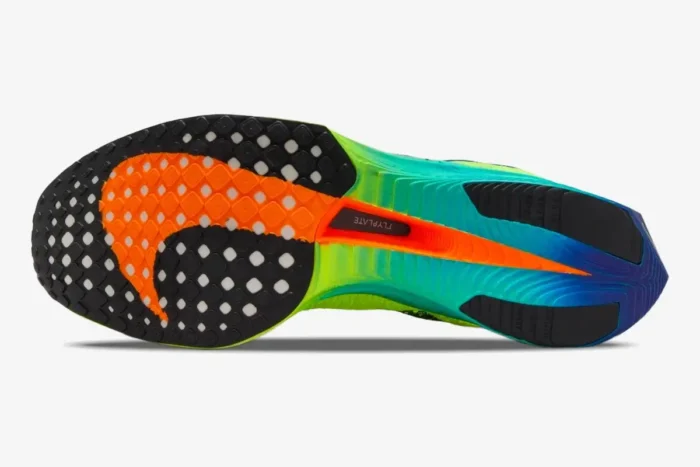 Bottom view of Nike ZoomX Vaporfly 3 marathon racer showing colorful sole with orange, yellow, and blue gradient. - SKU DV4129-700