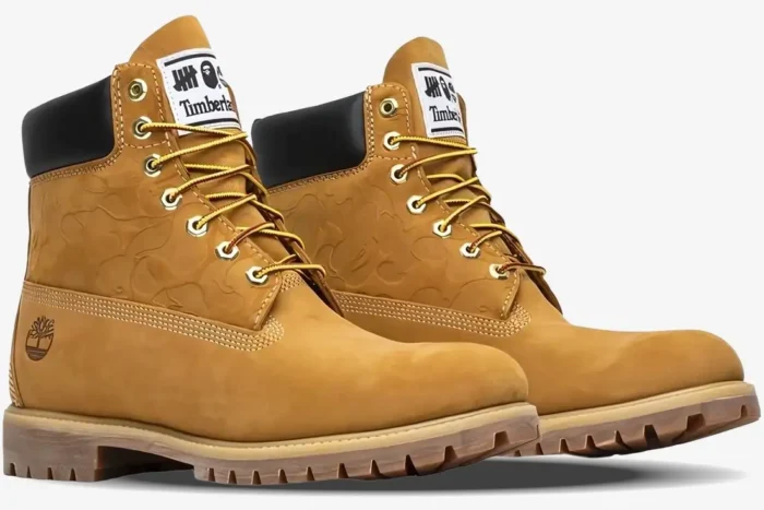 Timberland x BAPE x Undefeated 6-Inch Wheat boots with camo embossing, three-quarter side view. - SKU TB0A1R7Y231