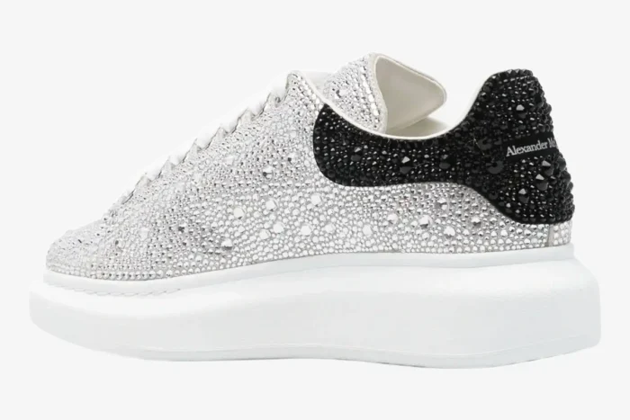 Side view of Alexander McQueen Oversized Sneaker with white crystals and a black crystal heel tab. - SKU 611697WHZ39