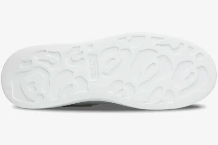 Sole view of a white Alexander McQueen Oversized Sneaker showing the signature leopard-print tread pattern. - SKU 553680-WHGP5-9000