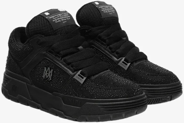 Pair of black Amiri MA-1 sneakers with crystal rhinestone details, three-quarter perspective. - SKU AMFOSR1038-001