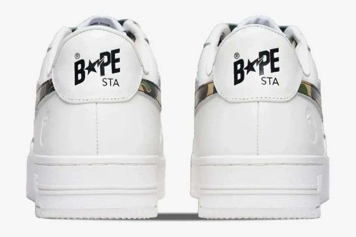 Rear view of white A Bathing Ape Bape Sta Low sneakers with ABC Camo Green accents and heel logos. - SKU 1K70191335-GRN