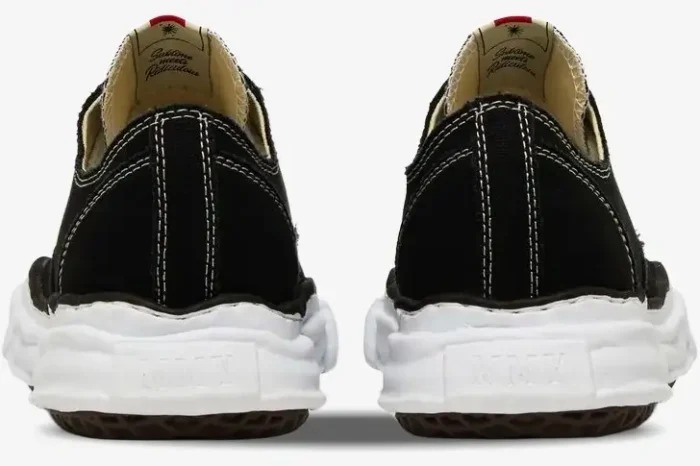 Rear view of Maison Mihara Yasuhiro Peterson OG Sole Canvas Low sneakers in black with wavy white midsoles. - SKU A01FW702-BLK