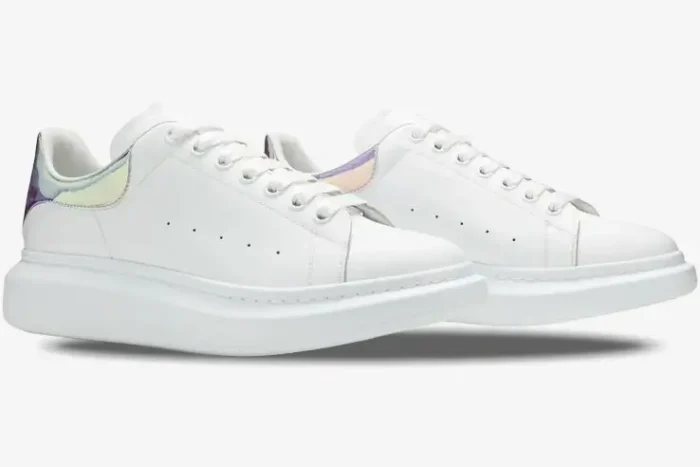 Alexander McQueen Oversized Sneakers in white with iridescent heel tabs, side view perspective. - SKU 553680-WHX92-9123