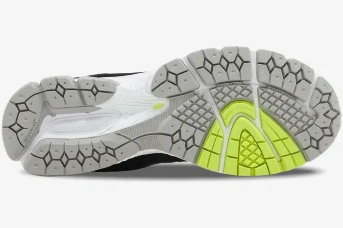 Bottom view of New Balance 2002R x DTLR Purple Noir outsole with grey, white, and neon yellow tread. - SKU M2002RHI