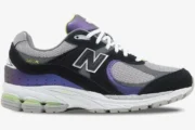 New Balance 2002R x DTLR Purple Noir sneaker side profile with black suede and iridescent purple panels. - SKU M2002RHI