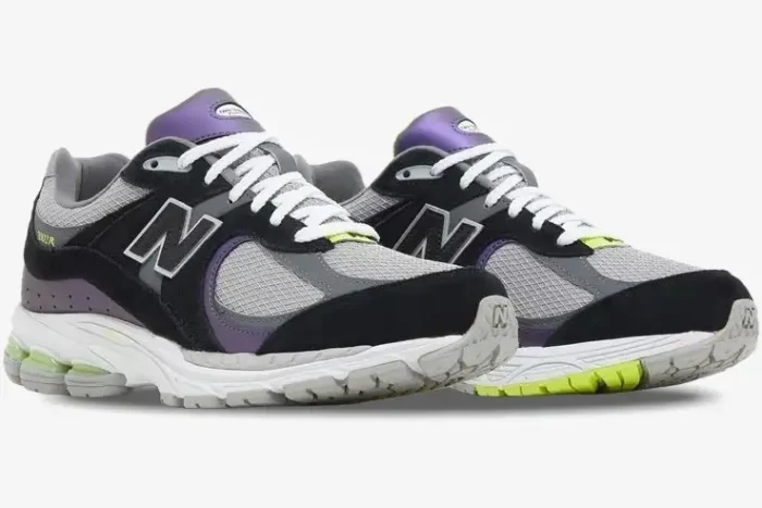 New Balance 2002R x DTLR Purple Noir sneakers in black, grey, and purple, side view. - SKU M2002RHI