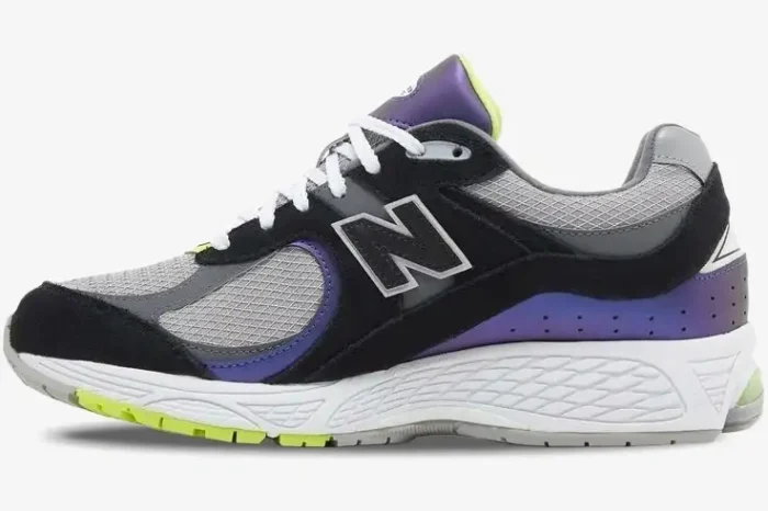 Side view of New Balance 2002R x DTLR Purple Noir sneakers in black, grey, and iridescent purple. - SKU M2002RHI