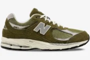 Side profile of New Balance 2002R Footlocker Exclusive sneakers in olive green suede and mesh. - SKU M2002RFO