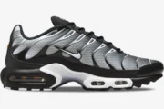 Side profile of Nike Air Max Plus TN Black Metallic sneakers featuring a grey gradient mesh and black overlays. - SKU DM0032-003