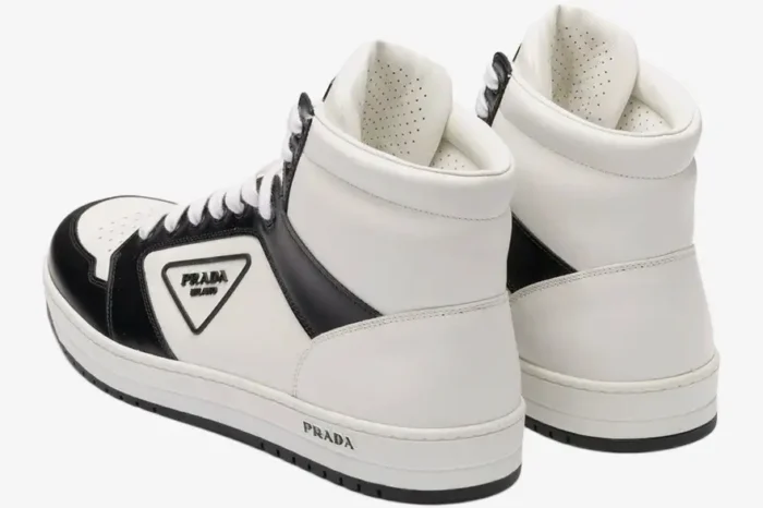 Prada District high top leather sneakers in white and black, shown from a rear three-quarter angle perspective. - SKU 2TE182-3LJ6-F0964