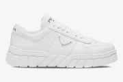Side view of white Prada low-top sneakers with a chunky geometric tread sole. - SKU 2EE3783LJ6F0009
