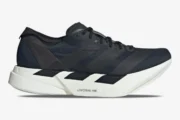 Side profile of Adidas Adizero Adios Pro 4 running shoe in black and white. - SKU JR6369