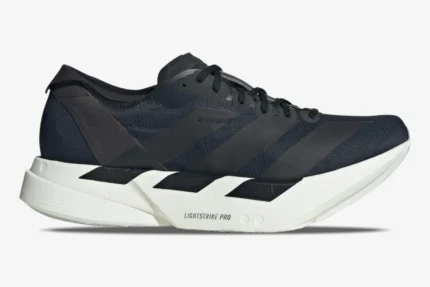 Side profile of Adidas Adizero Adios Pro 4 running shoe in black and white. - SKU JR6369