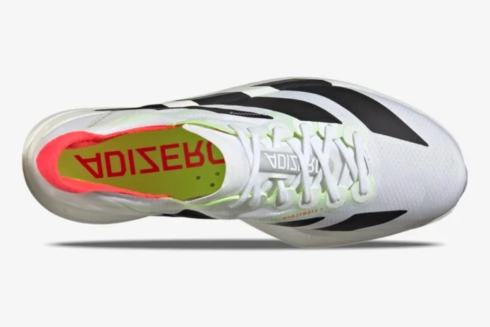 Top-down view of Adidas Adizero Adios Pro 4 running shoe in white, black, and red. - SKU JR1094