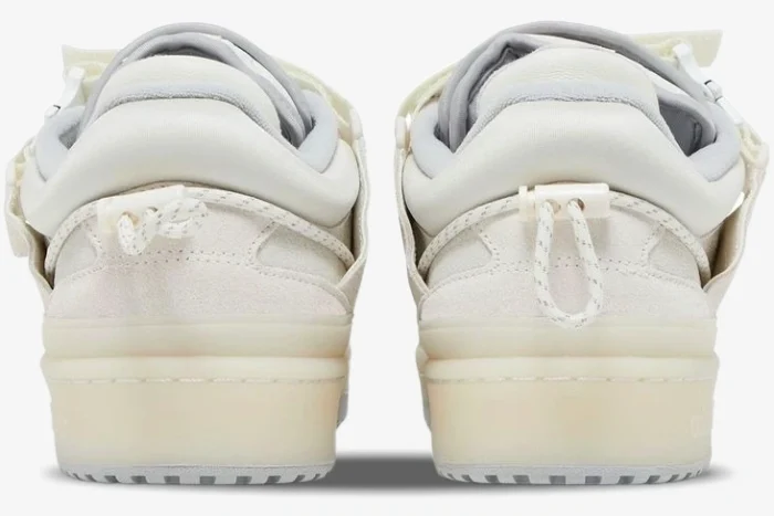 Rear view of Adidas Forum Buckle Low x Bad Bunny sneakers in white cream with toggle heel tabs. - SKU HQ2153