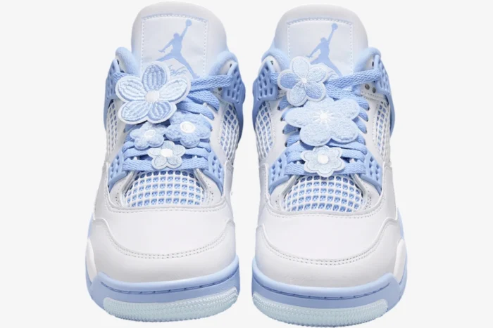 Front view of light blue and white Air Jordan 4 Forget Me Not custom sneakers with flower lace charms. - SKU HV0823-100