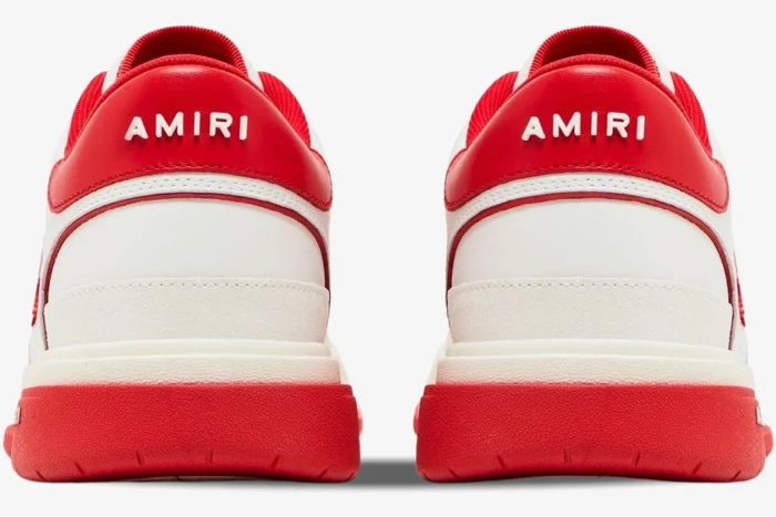 Back view of Amiri Classic Low 'White Red' leather sneakers showing the red heel tab with white logo. - SKU AMFOSR1043-147
