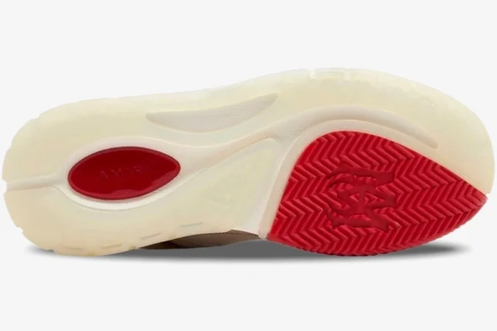 Bottom view of an Amiri MA-1 sneaker outsole in cream and red with herringbone tread and logo details. - SKU PS24MFS018-610