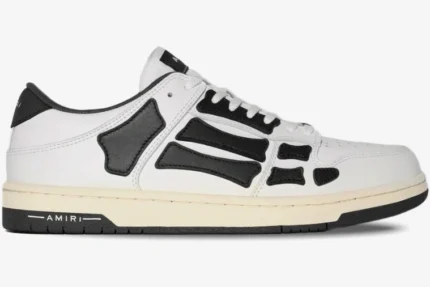 Amiri Skel Top Low sneaker in white and black leather, side profile view. - SKU PS22MFS003-111
