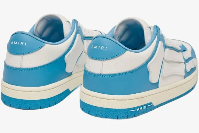 Rear view of Amiri Skel Top Low sneakers in white and blue with skeleton-inspired leather overlays. - SKU MFS003-462