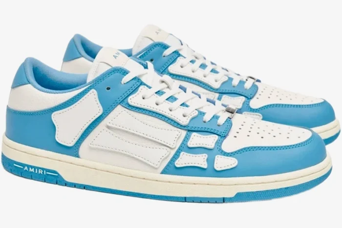 Amiri Skel Top Low sneakers in white and blue, side view showing skeleton bone leather overlays. - SKU MFS003-462