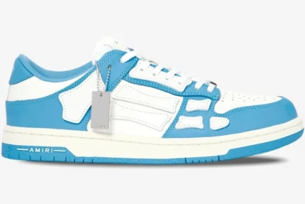 Amiri Skel Top Low sneaker in white and blue with skeleton bone appliqués, side profile view. - SKU MFS003-462