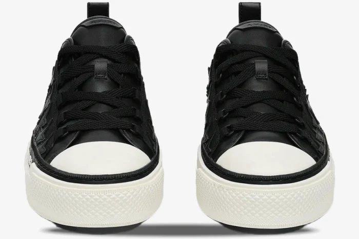 Front view of black Amiri Stars Court leather sneakers with white toe caps and thick white soles. - SKU AMFOSR1178-083