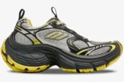 Side profile of a Balenciaga 10XL sneaker in grey and yellow with a chunky distressed sole. - SKU 792779w2mv21097