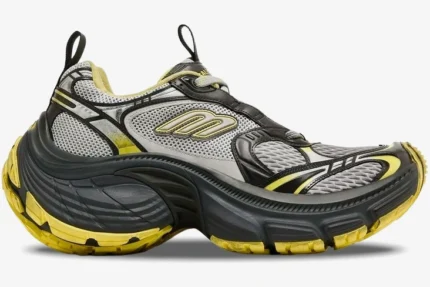 Side profile of a Balenciaga 10XL sneaker in grey and yellow with a chunky distressed sole. - SKU 792779w2mv21097