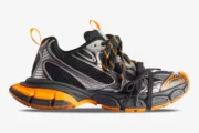 Side profile of Balenciaga 3XL mesh and polyurethane low top sneakers in orange, grey, and black. - SKU 734734W3XL31178