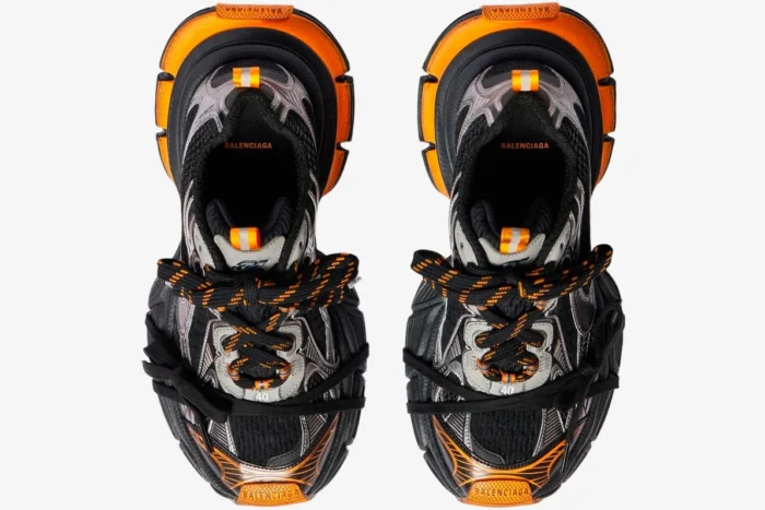 Top-down view of Balenciaga 3XL mesh sneakers in orange, grey, and black with chunky soles. - SKU 734734W3XL31178